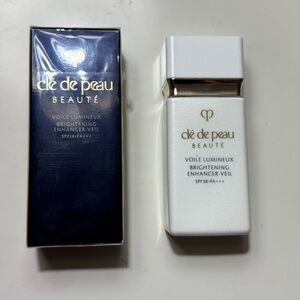 Clé de Peau Beauté Brightening Enhancer Veil - White and Gold